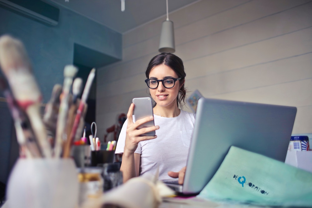 young woman looking at her phone