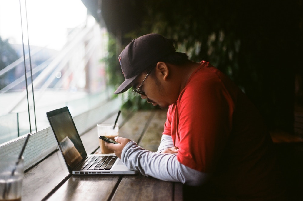 man looking at phone intently